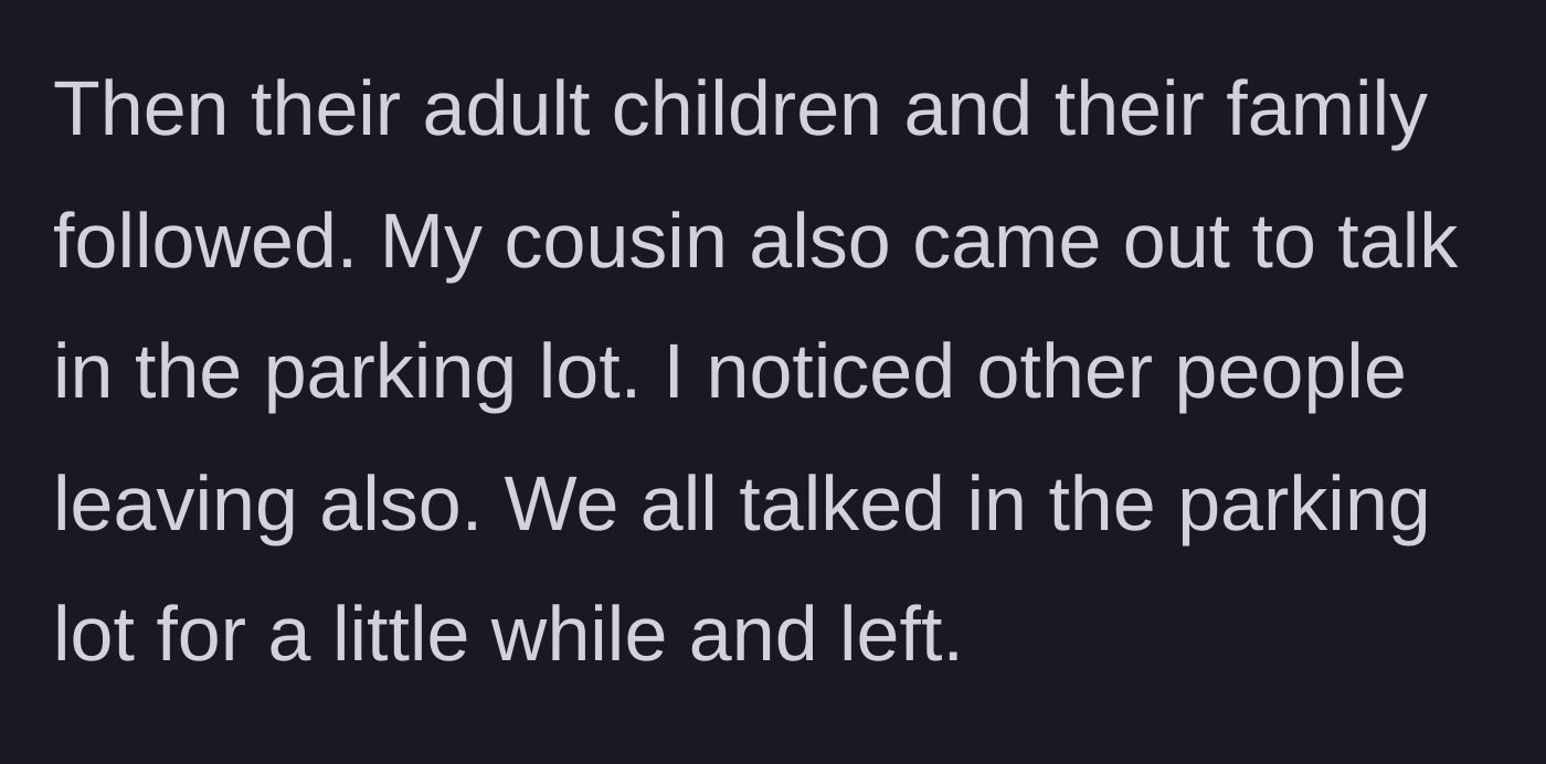 Story part 4 - A crowd of family members talking in the funeral home parking lot.